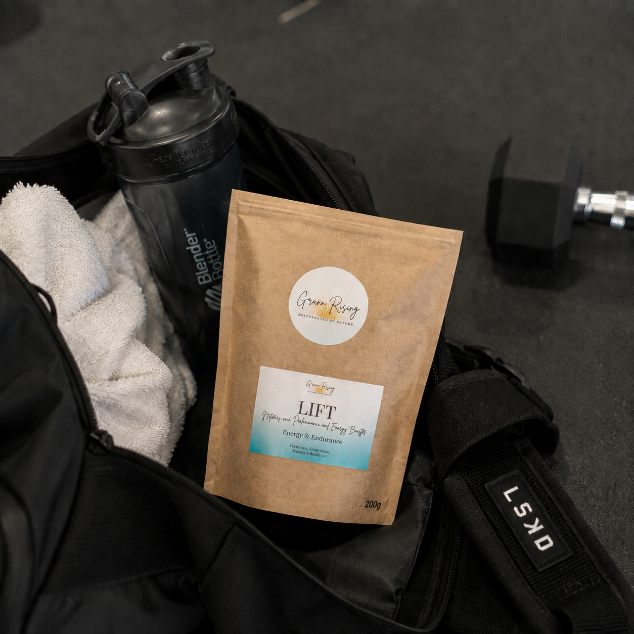 LIFT blend in a gym bag with shaker and dumbbell